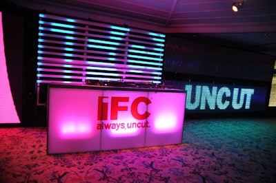 Walls lined with brightly colored tubing and LED and plasma screens projected visual riffs on the IFC logo.