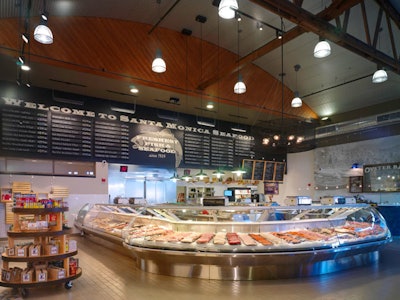 A refrigerated case offers fresh seafood.
