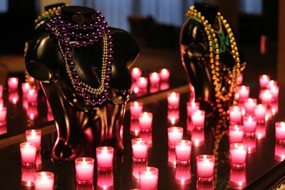 Candles and Mardi Gras beads topped a table outside the ballroom, where dinner was served.