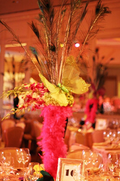 Feathers and silk butterflies dotted centerpieces at each dinner table.