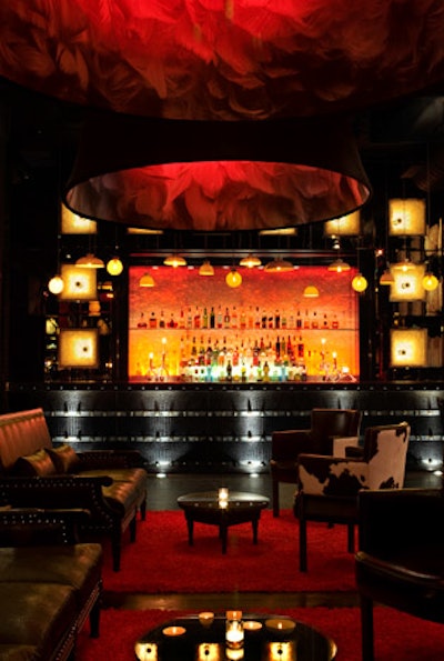 Oversize light fixtures offering images of feathers hang in the lounge.