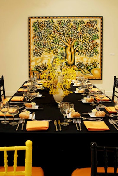 The yellow gallery featured rectangular tables topped with yellow floral centerpieces.