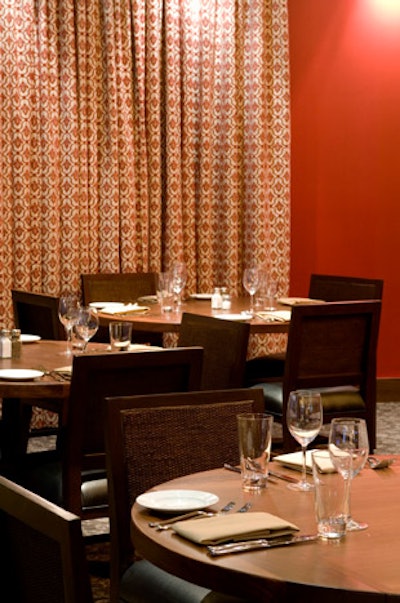 Red and white curtains surround the circular Heartland Room.