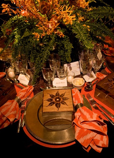 An ikat-patterned napkin was used on the table by Carrier and Company for Williams-Sonoma Home. A fanciful wooden box was a gift at each place setting.