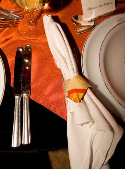 An origami napkin ring adorned each guest's plate at the Vicente Wolf table.