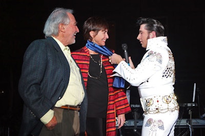 An Elvis impersonator serenaded museum patrons Sam Rose and Julie Walters.