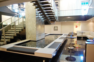 A pool of water creates a focal point in the lower-level lounge adjacent to the new King Street Social Kitchen/Bar.