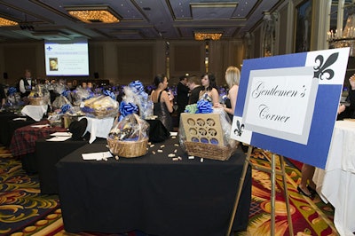 Event planners grouped silent auction items into themes such as 'Gentleman's Corner.'