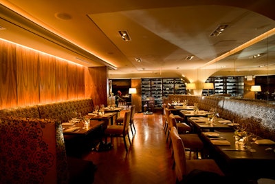 In the front of the restaurant is a bar and lounge area with a curving blond oak bar.