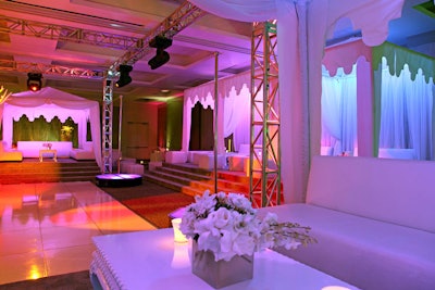 White flowers topped tables in seating clusters in the lounge.