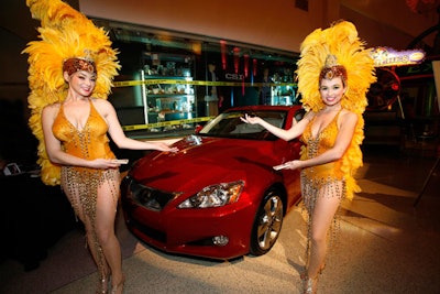 Show girls drew attention to a big-ticket raffle prize: a 2010 Lexus.