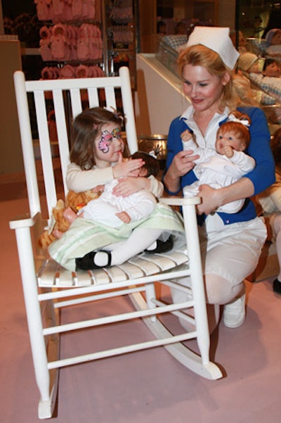 A singing nurse with a rocking chair and a doll is all you need to mesmerize a four-year-old girl.