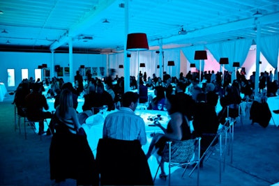 Quest Drape suspended white fabric across the venue to separate the cocktail and dinner areas.