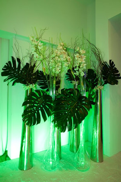 Oversized vases of orchids and greenery filled the foyer.