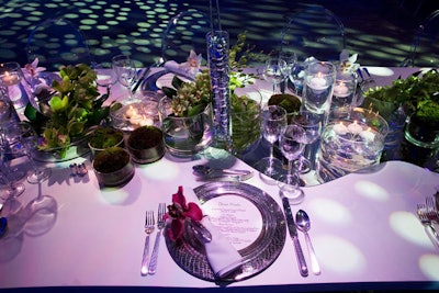 Dinner plates displayed the evening's menu from Restaurant Associates.