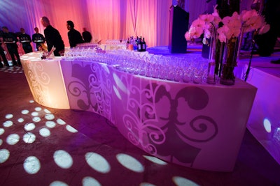 A curvy illuminated bar provided the focal point for the cocktail reception.