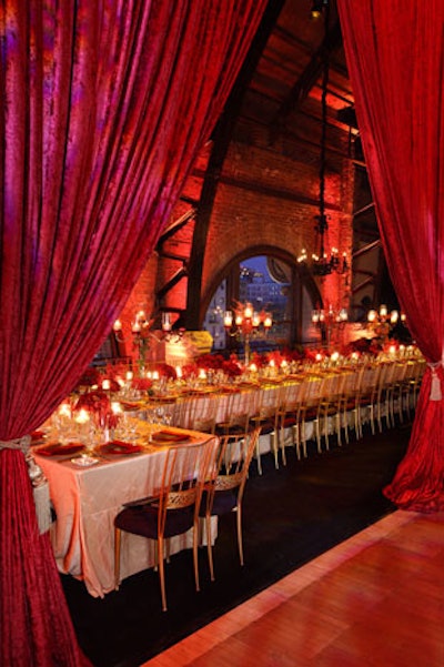 Tall red curtains were pulled back to reveal the dining room at the end of cocktail hour.