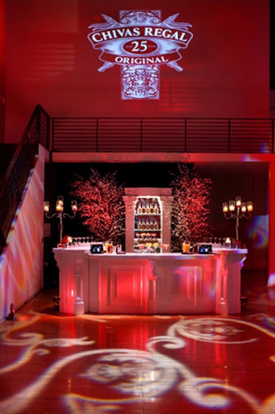 Flanked by blossoming white dogwood trees, the bar was the focal point of the cocktail area.