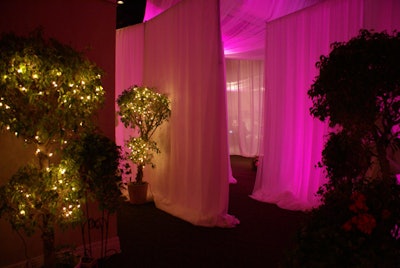 Guests walked through a labyrinth of white draping to the cocktail and dining areas.