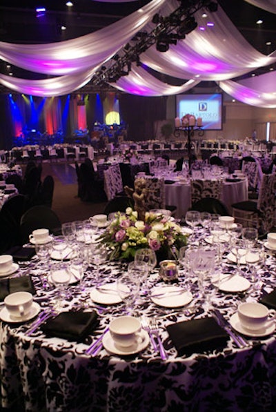 The dining space evoked a Gothic garden with black and white decor, purple lighting, and floral accents.