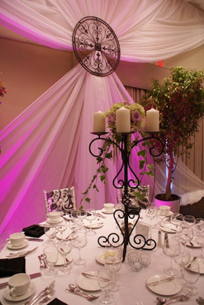 Silver, white, black, and brocade satin linens covered the tables.