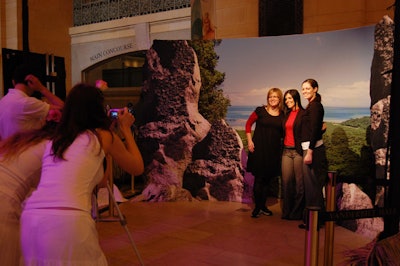 Guests posed for photos in front of scenic backdrops.
