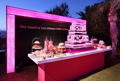 A dessert bar featured a giant ice sculpture that evoked the look of a tiered cake.