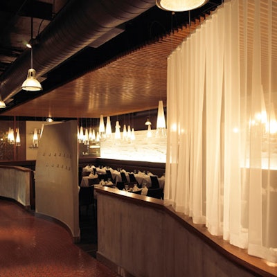 Solid teak panels carve out the ceiling in the dining room.