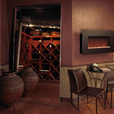 A faux fireplace creates a nook for guests near the west entrance to the restaurant.