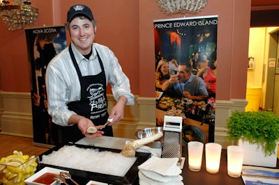 Canadian oyster shucking champion Jason Woodside served oysters at the Prince Edward Island booth.