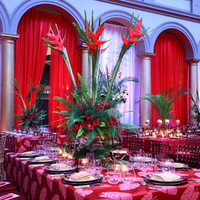 Palm fronds, votives, and glass vases were prominent in event designer David Tutera's table design, adding to the tropical flavor of the evening.