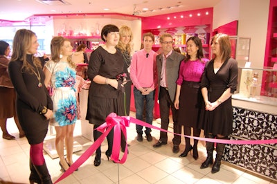 David and Glenn Dixon (centre) joined the designers from Foxy Originals and executives from the Bay and Mattel to cut a pink ribbon at the store opening.