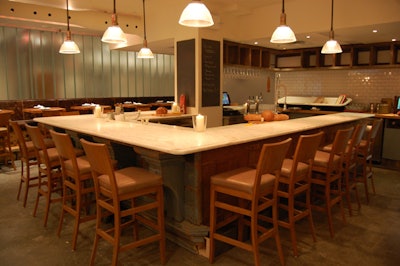 The wood facade on the marble-topped bar was reclaimed from an old insurance building in Guelph.