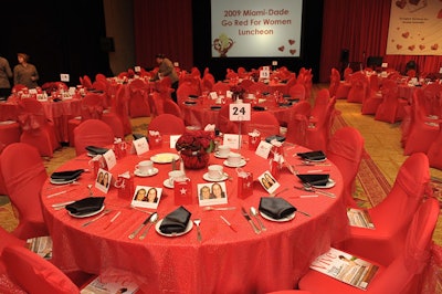 The red color scheme extended to the linens, chair covers, gift bags, and flowers inside the ballroom.