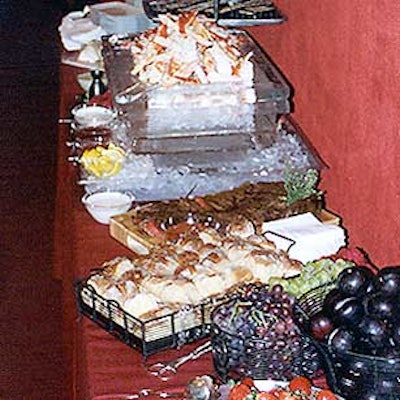 A buffet table with an ice sculpture.
