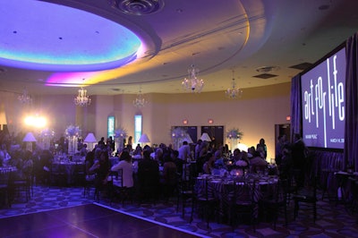 Circular tables topped with black-and-white linens filled the dining room.
