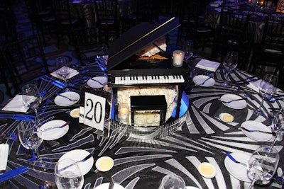 Miniature working pianos were one of two centerpieces used in the dining room.
