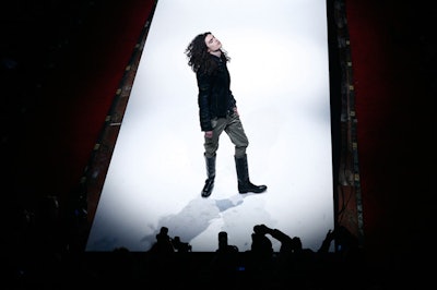 A model posed at the end of a runway at BoxEight Fashion Week.