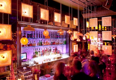 Hot pink lighting filled the restaurant, and bottles of 1X lined the display cases at the bar.