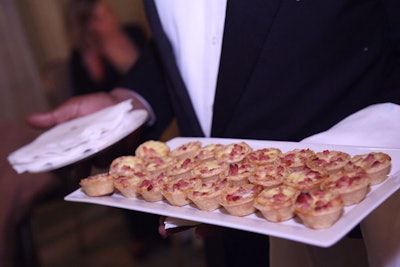Waiters passed bite-sized quiches made by the Willard's catering chefs.