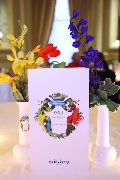 On each table, red, yellow, and blue flowers matched the color palettes of the new fragrances.