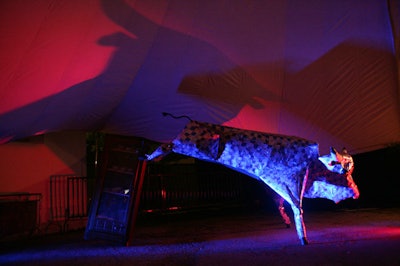 One of several metallic structures created especially for the Moon Tower, a giant bull near the entrance lets guests know who's hosting the event.