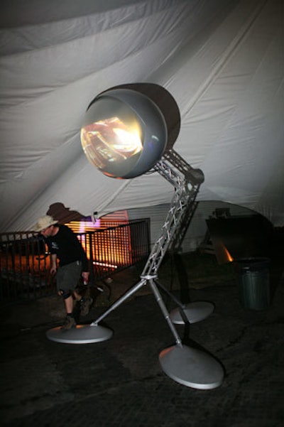 Another sculpture, a giant eye on top of a tripod, broadcasts the same visual installations and clips of live performances shown on screens and tents throughout the Moon Tower.