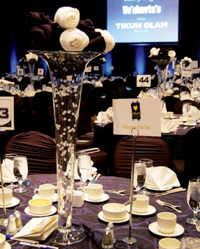 Centerpieces That Give Back Instead of flowers, tables at the Ve'ahavta's Starry Night gala in Toronto in November had towering glass vases filled with abstract-looking arrangements of navy and white socks�a donation from McGregor Socks that doubled as charitable gifts to the homeless.