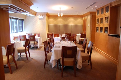 Tall banquettes line the back wall of the second-floor space, and three tables sit in the window overlooking Wellington Street West.