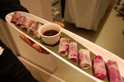 Servers passed hors d'oeuvres such as glass noodle rolls with roasted beets, seasonal vegetables, and pickled ginger and hoisin chutney.