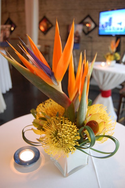 Grower's Flower Market & Gifts supplied tropical centrepieces with birds of paradise.