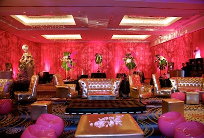 Originally intended for a private V.I.P. lounge outside, gold tufted couches, chairs, and ottomans with rhinestone buttons decorated the main seating area in the center of the ballroom.
