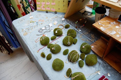 Local jewelry designer Michelle Rubin used moss and silky blue linens to spruce up her display area.