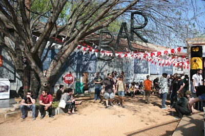 Using primarily industrial materials in the decor, piping fashioned into the letters B-A-R hung from a tree near one of the fort's watering holes.